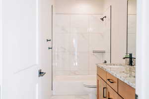 Bathroom featuring shower / bath combination and vanity