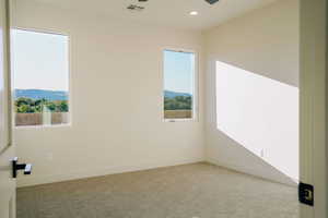 Spare room featuring carpet floors, recessed lighting, and ceiling fan