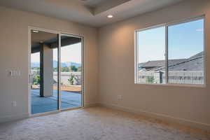 Empty room featuring recessed lighting and light colored carpet