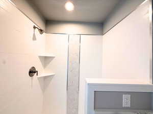 Bathroom view of a tile shower