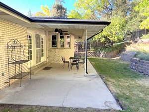 View of patio / terrace with ceiling fan, outdoor dining area, and stairway