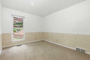 Unfurnished room featuring carpet flooring and baseboards