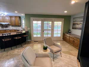 Sitting room featuring recessed lighting and french doors