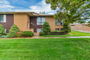 Mid-century home with brick siding