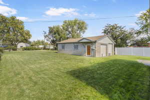 View of yard featuring a detached garage