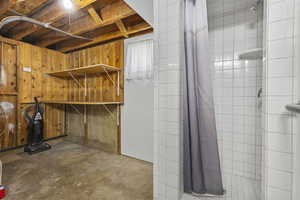 Unfinished basement with wooden walls