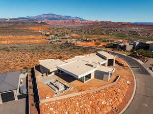 Aerial perspective of suburban area featuring a mountain backdrop