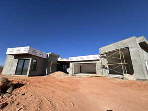 Property in mid-construction featuring stucco siding