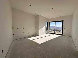 Spare room with unfinished concrete floors