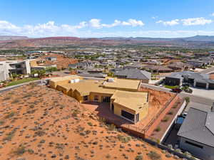Aerial view of residential area featuring a mountainous background