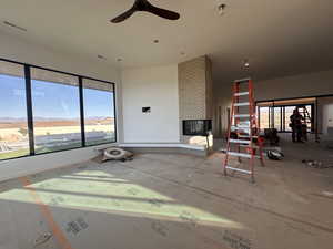 View of patio / terrace featuring a ceiling fan and a mountain view