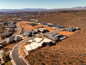 View of property location featuring mountains and nearby suburban area