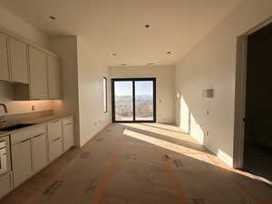 Kitchen with wood finished floors and light countertops