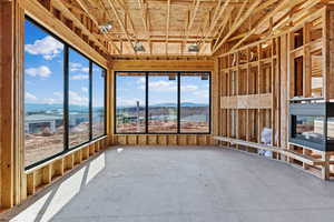 Unfurnished sunroom featuring a mountain view