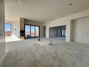 Unfurnished living room featuring plenty of natural light