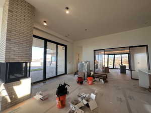 Living area with healthy amount of natural light and a fireplace