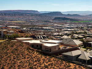 Aerial perspective of suburban area featuring a mountain backdrop