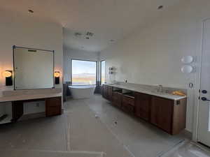 Bathroom with vanity and a soaking tub
