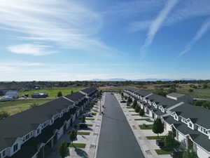 Aerial perspective of suburban area featuring a mountainous background