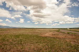 View of nature featuring rural landscape and a mountain backdrop