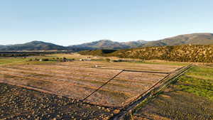 View of mountain backdrop with rural landscape