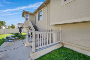 View of home's exterior with stucco siding and a patio area