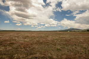 View of local wilderness featuring rural landscape and a mountain backdrop