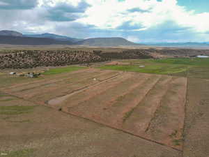 View of mountain background featuring rural landscape