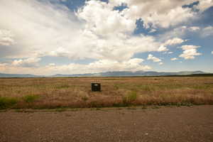 View of mountain backdrop with rural landscape