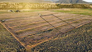 View of mountain backdrop with rural landscape