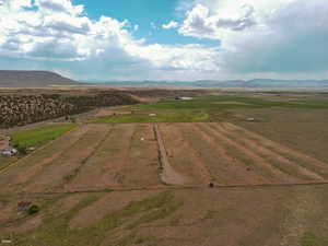 Overview of rural landscape with a mountain backdrop