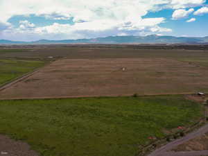 View of mountain backdrop with rural landscape