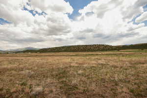 View of mountain background featuring rural landscape
