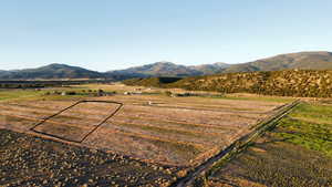 View of mountain backdrop with rural landscape