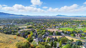 Aerial view of residential area featuring mountains