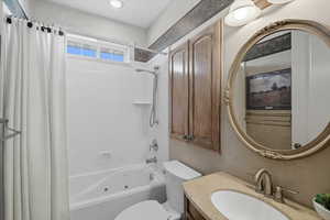 Bathroom featuring shower / bath combo and vanity