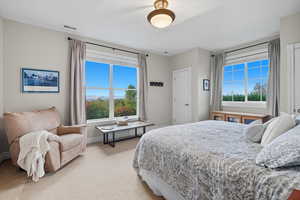 Bedroom with carpet flooring and baseboards