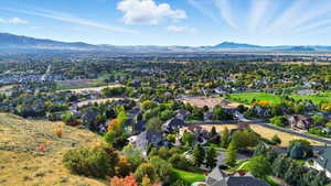 Aerial view of residential area with a mountainous background