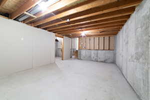 Unfinished basement featuring stairs