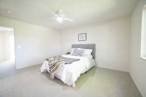 Bedroom with carpet floors and a ceiling fan