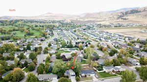 Aerial perspective of suburban area with a mountain backdrop
