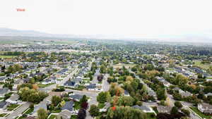 Aerial view of residential area featuring a mountainous background