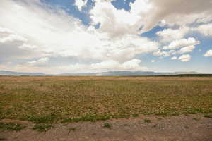 View of mountain background featuring rural landscape