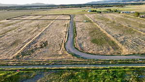 View of rural area with a mountainous background and abundant farmland