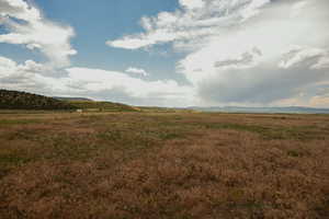 View of undeveloped land with rural landscape and mountains
