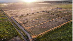 Aerial view of sparsely populated area featuring extensive farmland