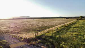 View of yard featuring a view of countryside and a mountain view