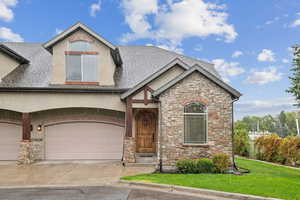 Rich, refined exterior with rock work, stucco and wood enhancements.