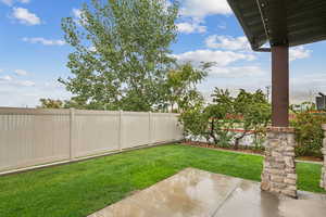 Fenced backyard featuring a patio, mountain view