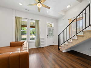 Entrance foyer featuring dark wood-type flooring, healthy amount of natural light, recessed lighting, stairs, and a ceiling fan